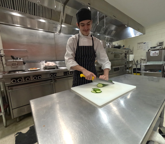 Cutting cucumbers in our kitchen. Open Gallery